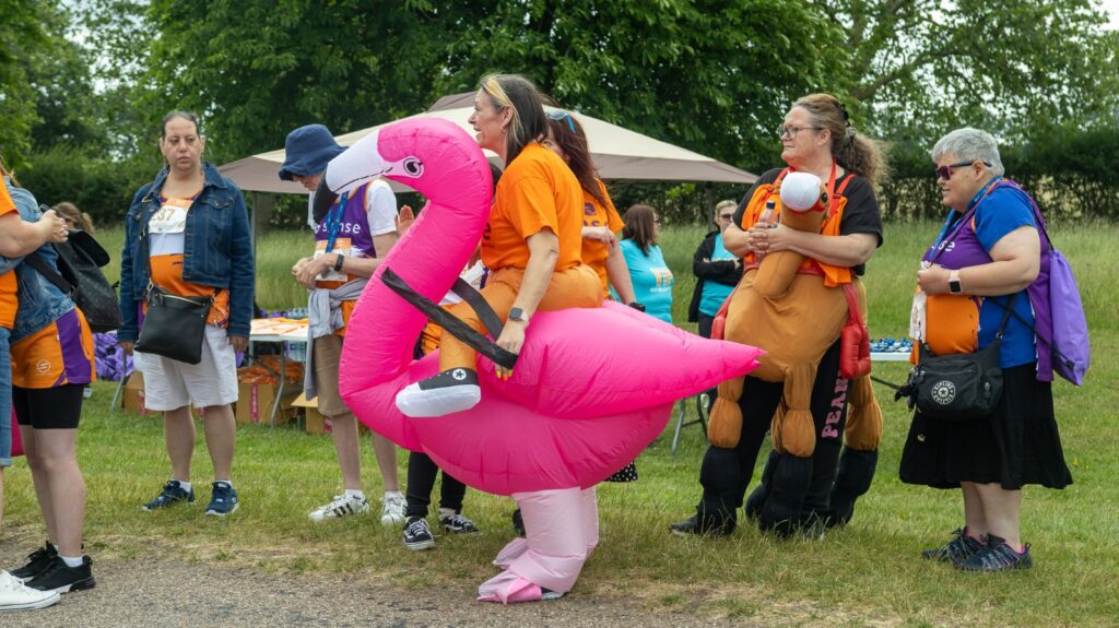 Person in giant flamingo costume